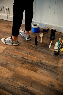 a person standing by a bunch of tools for home renovations